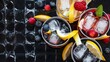 © Kartik - Chilled soft drinks with ice, citrus fruits and berries, black background, selective focus