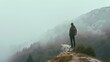 © VK Studio - A lone hiker stands on a rocky outcrop, gazing at the misty mountain landscape, surrounded by ethereal fog and dense forest, capturing a moment of introspection and adventure.