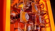 © Kartik - Close up view of arrangement of glasses of beer on orange backdrop