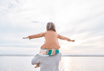 Wall Mural - Father, girl and shoulder carry at beach for plane, bonding and relax with portrait, freedom and sky. Family, dad and child outdoor at ocean for adventure, tropical holiday and travel in Maldives