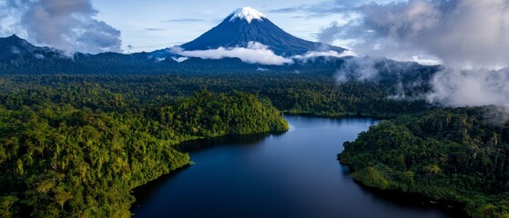 Poster -  A vast expanse of water encircled by verdant trees and a distant mountain, crowned with clouds