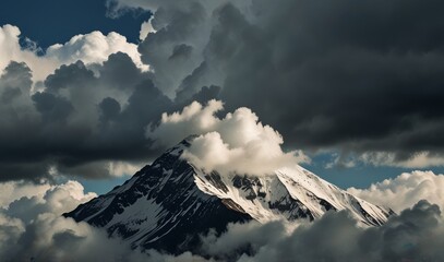 Wall Mural - mountain peak partially obscured by clouds, symbolizing the theme The High