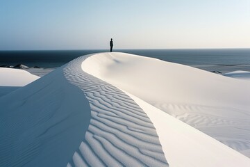 Sticker - A lone figure stands atop the rolling dunes of Whitesand in an analog film photo at dawn 