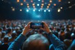 © Sameer - Audience at a business conference. Person taking photo with smart phone, Generative AI