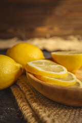 Fresh and juicy lemon on a dark rustic background