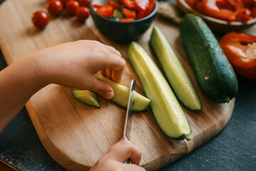 Girl cutting salad, organic healthy food