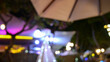 © sutichak - bokeh of restaurant neon light, blur nightclub background in the night