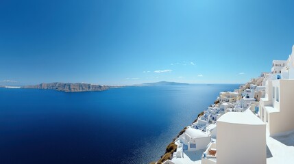 the panoramic view of santorini white washed buildings overlooking the deep blue aegean sea, greece