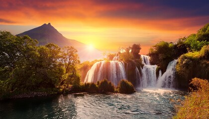 Wall Mural - fantasy landscape with waterfall at sunset