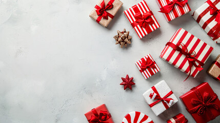 Poster - Christmas presents in red and white wrapping paper are lying on a table, forming a festive background with space for text