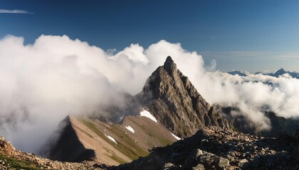 Poster - mountain peak rising above clouds in serene rugged wilderness