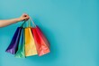 © yachyah - Colorful Shopping Bags on Blue Background