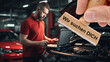 © Wolfilser - Ein Holzstempel ist beschriftet mit dem Aufdruck: Wir suchen DICH über dem Bild eines Automechanikers in einer Autowerkstatt - FOTOMONTAGE