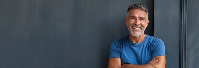 Smiling Man Portrait Against a Grey Wall