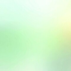 A soft and blurry abstract image with a gentle blend of light colors, including pale greens, yellows, and whites.