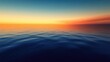© Matcha_09 - A panoramic view of the open sea at twilight, with the sky transitioning from orange to deep blue and the water calm.