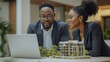© The Little Hut - Attractive Asian businessman and African American female real estate and land investor talk discussing together on table with laptop and small building model Reserve fund : Generative AI
