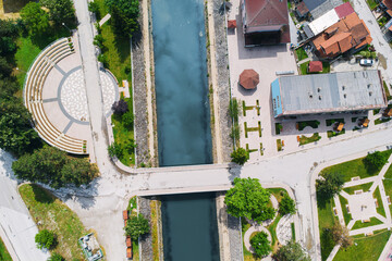 Wall Mural - Picturesque aerial image of Ovcar-Banja streets and bridges, offering a glimpse of its scenic beauty and tranquil environment during the summer season.