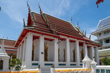 Thailand, August 11, 2024, Wat Phitchaya Yatikaram Worawihan, A serene Buddhist temple in Thailand, showcasing intricate architecture and golden statues during a sunny day