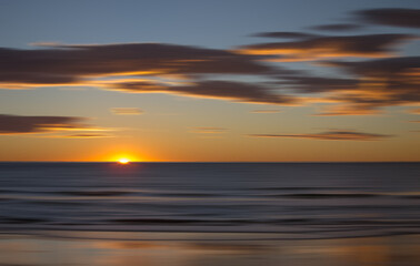 sunset sea and cloudscape with blurred sea