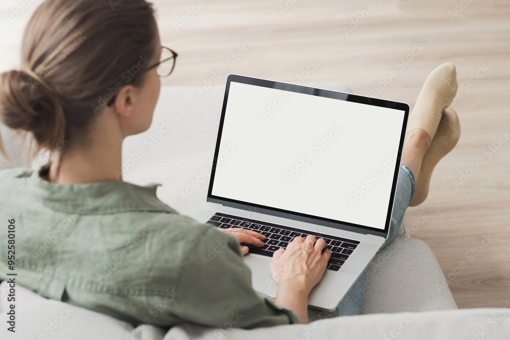Young woman using laptop computer with blank empty white screen mockup ...