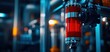© Rossarin - Close-up of a vibrant red industrial valve in a modern factory setting, showcasing advanced piping and mechanical engineering.