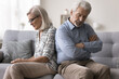 © fizkes - Dissatisfied mature spouses sit on sofa in silence, deep in thoughts about their conflict, misunderstanding, toxic, destructive relationships, thinking about divorce, split. Marriage, relations end