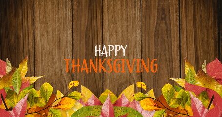 Sticker - Image of happy thanksgiving overautumn leaves and wooden background