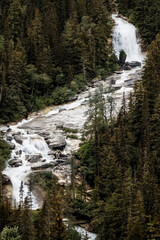 Wall Mural - Alaskan waterfall in the mountains