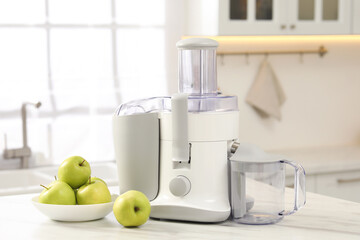 Wall Mural - Modern juicer and apples on white marble table in kitchen