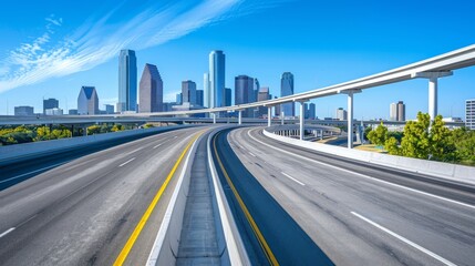 Highway interchange with a city skyline in the distance and clear blue skies