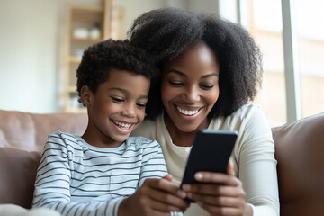 Close-Up of Mother and Son Using Smartphone. African mother and son smiling looking at smartphone, ideal for family and technology themes.