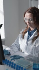 Aufkleber - Female Scientist Conducting Research in a Modern Laboratory Setting Using Laptop and Test Tubes