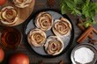 © New Africa - Freshly baked apple roses, ingredients and tea on wooden table, flat lay