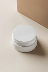 Poster - A white cream container is positioned on a minimalistic beige and white diagonal surface, highlighting its clean design in an elegant layout