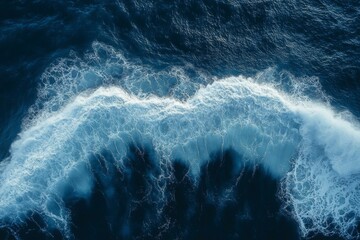 Spectacular aerial top view background photo of ocean sea water white wave splashing in the deep sea. Drone photo backdrop of sea wave in bird eye waves.