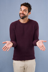 Poster - Business, portrait or shrug of man for choice with decision, option or comparison with scale for balance. Professional, person or happy with hand gesture for weighing opportunity on studio background