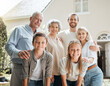© KayJoint/peopleimages.com - Portrait, real estate and smile with big family outdoor together at new home for fresh start. Love, property and happy with parents, senior people and sibling kids in garden of neighborhood apartment