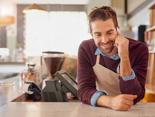 Canvas Print - Businessman, barista and cafe with phone call for online service, conversation order at coffee shop. Happy man, waiter or business owner with smile on mobile smartphone in discussion at restaurant