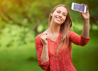 Canvas Print - Woman, outside and selfie in park, happiness and photography in nature for memories on weekend break. Social media, blog update and confident person on summer holiday, garden and screen in Canada