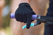 © Michael Cunningham/peopleimages.com - Hands, closeup and brakes of man on bicycle for cycling, fitness and exercise outdoor with fingers. Cyclist, gloves and hands on steering bar for sport, mountain bike or gear in nature in competition