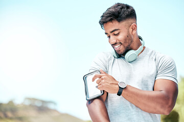 Wall Mural - Happy man, fitness and phone screen with headphones in nature for tracking performance, workout or exercise. Active or young male person with smile on mobile smartphone, training app or outdoor run