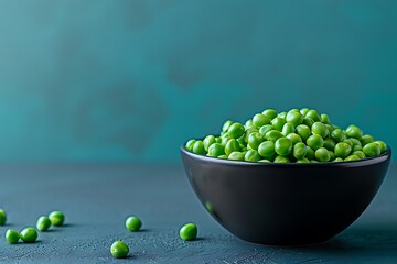 Wall Mural - Fresh green peas in a bowl on color background