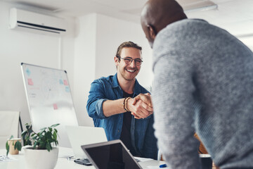 Canvas Print - Meeting, deal and men with handshake in workshop in onboarding, b2b opportunity or introduction to design. Office, agreement or happy business people shaking hands for welcome to creative partnership