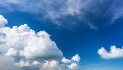 Wall Mural - beautiful blue sky with moving clouds looking up with blue sky and white fluffy cloud