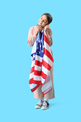 Canvas Print - Little girl with USA flag on blue background. Veterans Day celebration