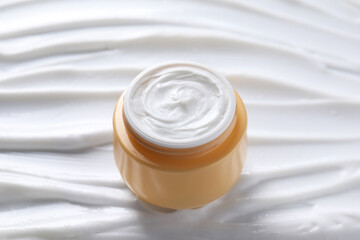 Wall Mural - Jar with face cream, closeup. Cosmetic product