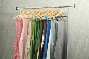 Sticker - Aprons on clothing rack near light grey wall