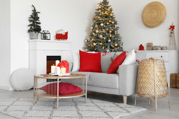 Sticker - Interior of living room with sofa, fireplace and burning candles