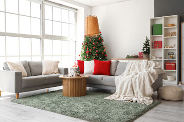 Sticker - Interior of living room with Christmas trees, sofas and candle holders